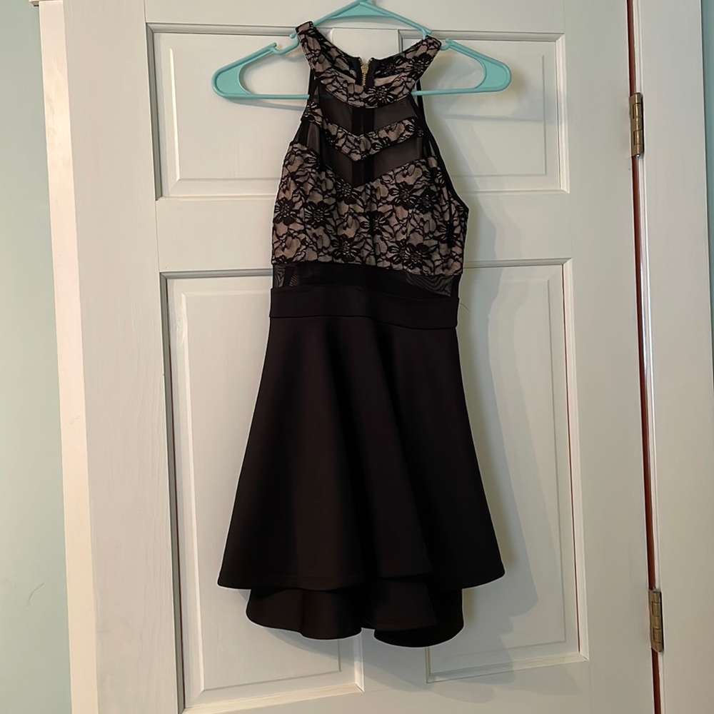 Flowy short black dress with nude underlay